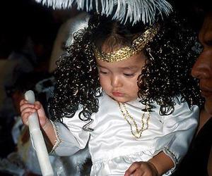 This little angel takes a break from the Holy Week pageantry in Taxco, Mexico. © Jim Allen, 2002