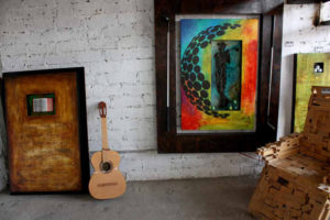 Musical instruments play a large role in the work of Mexican artist Ivan Guaderrama. Here he has an antique guitar awaiting his flourishes. © Mariah Baumgartle, 2011