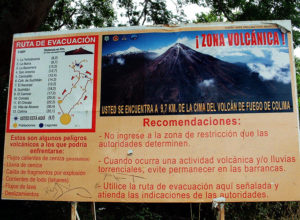 A sign just outside La Maria near Comala, Colima, warns people that they are only 9.7 kilometers from an active volcano © John Pint, 2012