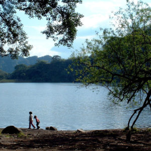 Children play on the shore of Mexico's Laguna La Maria, which offers many shady places to camp as well as inexpensive cabins © John Pint, 2012