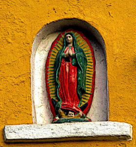 The Virgin of Guadalupe watches over passerbys in Old Mazatlan. Also known as the Centro Historico, this cultural heart of Mazatlan has been going through a renaissance as old buildings, some dating back 200 years, are refurbished by both Mexican nationals and a growing expatriate community. This original photograph forms part of the Olden Mexico collection. © Darian Day and Michael Fitzpatrick, 2009