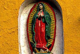 The Virgin of Guadalupe watches over passerbys in Old Mazatlan. Also known as the Centro Historico, this cultural heart of Mazatlan has been going through a renaissance as old buildings, some dating back 200 years, are refurbished by both Mexican nationals and a growing expatriate community. This original photograph forms part of the Olden Mexico collection. © Darian Day and Michael Fitzpatrick, 2009
