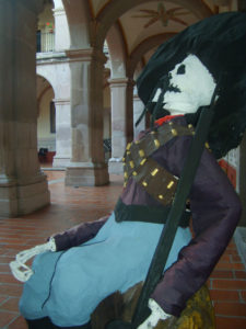 Wearing a wide sombrero and bandoliers across his chest, a revolutionary soldier relaxes in the corredors of Mexico's Museo Nacional de la Muerte (National Museum of Death). Skeleons come out for Day of the Dead to carry on their habitual tasks even in the afterlife. © Diodora Bucur, 2009