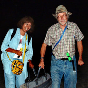 Photographers Susy and John Pint. To film the volcano's pyrotechnics, one must wander out into the jet-black night, perhaps bumping into a cow or two. © John Pint, 2012