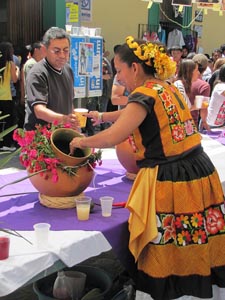 In Oaxaca on the on Dia de la Samaitana, agua fresca, or fresh fruit drinks are offered to passersby