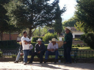 Village locals in the Michoacan lakeside town of Zirahuen enjoying a conversation in the main plaza. © Linda Breen Pierce, 2009