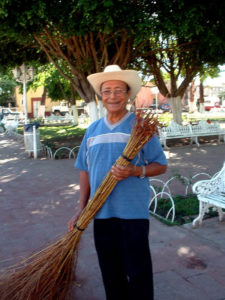 A worker in Teuchitlán's plaza defends the superiority of old-style brooms over the modern version. Despite its new-found fame, the Mexican town is still as charming as ever. © John Pint, 2009