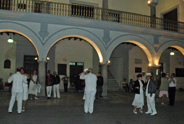 Dressed in tropical white, couples perform the sensuous danzon in the Plaza de Armas in Veracruz City. © Roberta Sotonoff, 2009