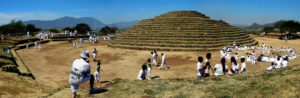 A panoramic view of white-clad visitors conducting workshops and ceremonies at Teuchitlán to celebrate the vernal equinox.The monumental architecture seen at Mexico's Guachimontones archeological site is based on concentric circles, a style no other civilization on earth has ever adopted. © John Pint, 2009