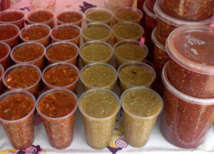 Three kinds of homemade salsas are some of the delicious offerings in a tianguis, or traveling Mexican market. © Daniel Wheeler, 2009