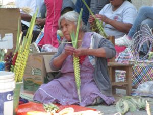 Decorating palm fronds on Palm Sunday in Mexico © Tara Lowry, 2014