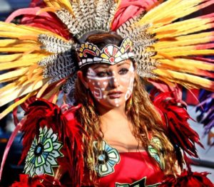 Elaborate headdresses with exotic feathers. © Tara Lowry, 2015