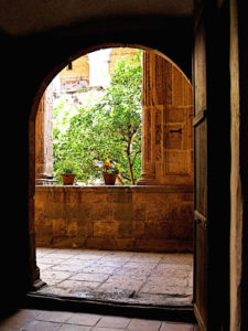 The porteria, or porter's room, in the Ex-Convento de San Pablo Apostol in Yuriria, Michoacan. This room gives way onto the lower arcade, which surrounds the greenery of the interior courtyard and, in former days, provided entrance to the common rooms of the convent. This original photograph forms part of the Olden Mexico collection. © Darian Day and Michael Fitzpatrick, 2010