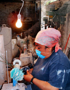 An obsidian piece receives its final polish in the rustic workshop of Navajas. The Mexican state of Jalisco has some of the richest obsidian deposits in the world. © John Pint, 2009