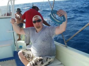 With only a hook and line, this deep sea fisherman caught 22 fish in 15 minutes in the waters off Isla Mujeres! © Louie Frias, 2013