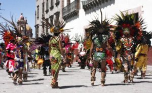 The conchero dancers get their name from the stringed instrument similar to a lute that is used in the dance ceremonies. © Tara Lowry, 2015