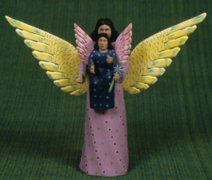 A ceramic guardian angel with a child is the work of Oaxaca artisan Gabino Reyes Lopez. © Arden Aibel Rothstein and Anya Leah Rothstein, 2007