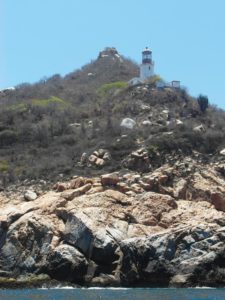 The lighthouse at Cabo Corrientes on Banderas Bay in Mexico © David Kimball, 2013