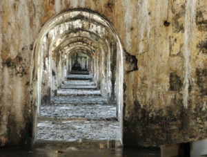 Narrow stone-lined passageways lead to a labyrinth of dungeons in the Fort of San Juan Ulua. A landmark in the Mexican city of Veracruz, it was first built as a castle in the 1550s. It served as a background for the chase scene in the movie "Romancing the Stone." © Roberta Sotonoff, 2009