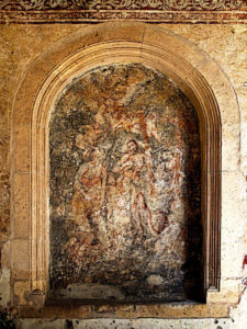 Murals still remain in niches and above doorways in the ancient Augustinian convent in Yuriria, Michoacan. Religious figures dance like apparitions through the centuries-old paint. This original photograph forms part of the Olden Mexico collection. © Darian Day and Michael Fitzpatrick, 2010