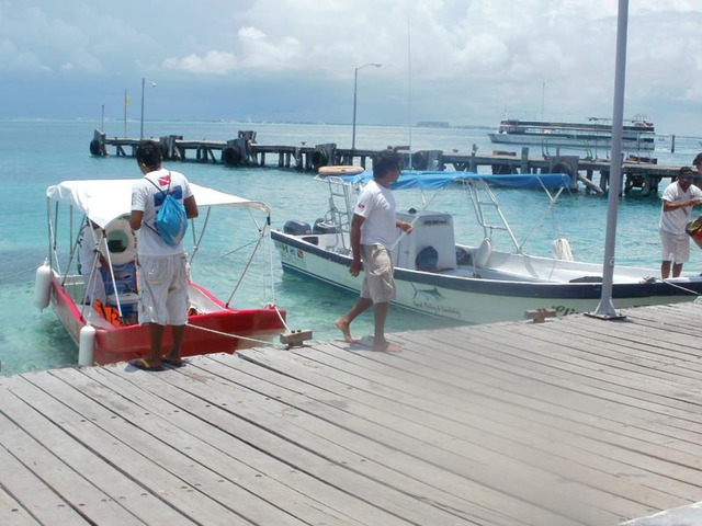 Days end after a fishing trip on Isla Mujeres. Outcome, success. © Louie Frias, 2013