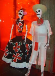 A skeleton couple wears the traditional dress of early 19th century Mexico. Familiar sights during Mexico's Day of the Dead festivities, this pair is on display in the Museo Nacional de la Muerte (National Museum of Death) in Aguascalientes. © Diodora Bucur, 2009