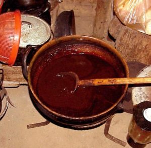 A huge clay casserole of mole awaits guests.