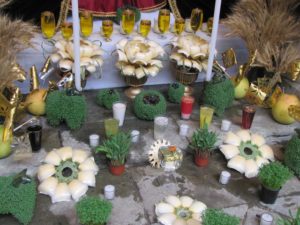 Altars to the Virgin de Dolores in Oaxaca include clay pots with chia sprouts representing new life, glasses of water representing tears; and gold paper flags which symbolize purity © Tara Lowry, 2014