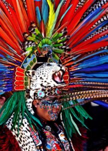 A jaguar head dress with feathers resplendant. © Tara Lowry, 2015