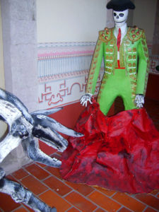 Even in the afterlife, a bullfighter wears his splendid traje de luces and fights a skeletal bull. These whimsical Day of the Dead sculptures can be seen in Mexico's Museo Nacional de la Muerte (National Museum of Death) in Aguascalientes. © Diodora Bucur, 2009
