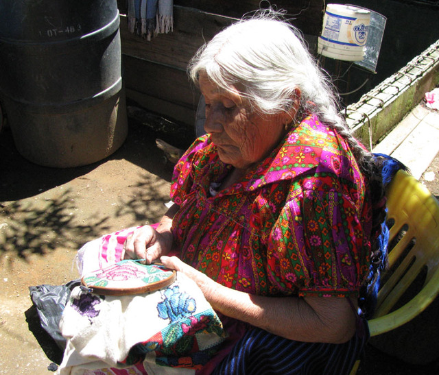 Hermelinda Reyes Ascenio works on a guanengo, or traditional blouse, in the patio of her granddaughter's Cocucho, Michoacan home. © Travis Whitehead, 2009