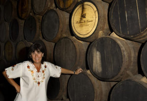 Monica Baeza, owner and operator of Hacienda El Carmen, with hundreds of barrels of house tequila. John Pint, 2011