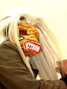 A Tastoan dancer wears an original mask by Prudencio Guzman that he names "Lencho." Tastoanes battle Saint James in a ritual dance each year on July 25th. © Kinich Ramirez, 2006