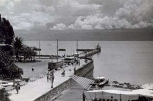 ﻿Lake Chapala, Mexico, in August 1965. Buses brought weekend visitors to Chapala pier where they strolled in the sunshine or sat in deckchairs in front of the BeerGarden enjoying the view. Photo in family collection of Marsha Sorensen; all rights reserved.