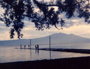 This picture of Ajijic pier (taken in 1966) shows the lake lapping against Ajijic pier. Marsha is standing on the end of the pier; leading her horse into the lake to take a bath! Photo in family collection of Marsha Sorensen; all rights reserved.