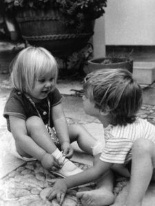 In April 1972, kids could be kids. Here, Marsha's son Micah plays contentedly with Alex Falloon in her yard. Photo in family collection of Marsha Sorensen; all rights reserved.