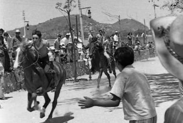 ﻿Far more exciting was watching a horserace in San Antonio. With a clattering of hooves, stallions thundered by galloping towards the lake. Photo, now in collection of Tamara Johnson, taken by Beverly Johnson; all rights reserved.