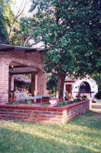 Orange trees surround the restaurant and office at Bungalows Koala