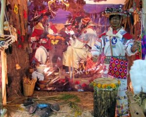 The Wixarika World's central scene depicts mannequins in a typical Huichol village setting. © Kinich Ramirez, 2006