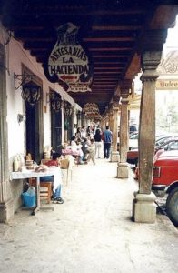 Hand carved wooden signs beckon the visitor. Photography by Bill Arbon. © 2001