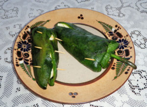 Stuff the peppers with cheese and carefully close them with wooden toothpicks © Daniel Wheeler, 2010