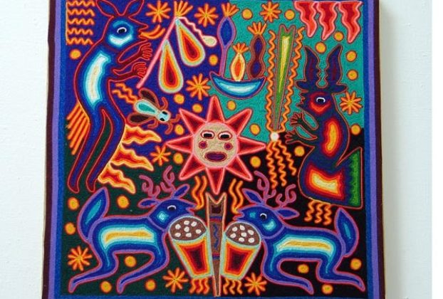 This nearika -- Huichol yarnwork "votive" painting -- depicts the sacred blue deer, who also appear as shamans on eac side of the composition. © Kinich Ramirez, 2006