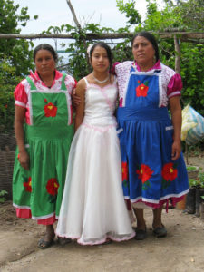 Gloria, Luci and Maria — the women potters of San Marcos Tlapazola — celebrate Luci's graduation from publisc school. These talented ceramists create both traditinal and innovative forms of Mexican ceramicpottery. © Alvin Starkman, 2010