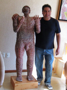 Manuel Reyes with life-size clay sculpture, "Tattoo Man" in his Oaxaca, Mexico woorkshop. © Alvin Starkman 2008