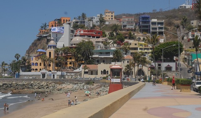 Apartments and mansions cling to the cliff along the famous Mazatlan malecon. © Gerry Soroka, 2009