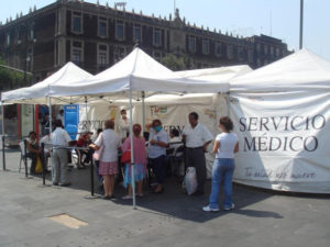 Citizens await checks at a Mexico City medical stall set up near the Cathedral in the Historic Center. Mexico responded swiftly to the outbreak of swine flu. © Anthony Wright, 2009