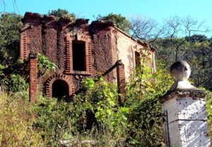 Ruins of once beautiful buildings are now overgrown with weeds at Mexico's once prosperous mining site of El Amparo © John Pint, 2012