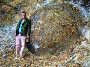 Roberto 'Beto' Lopez Santiago of Etzatlán with a giant stone ball seen along the road to Amparo, which lies only five kilometers northwest of Las Piedras Bola © John Pint, 2012