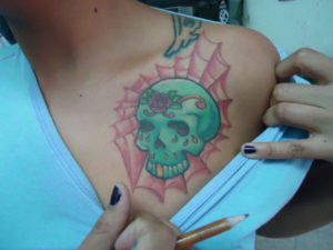 A graduate in Fine Arts and tattoo artist in Oaxaca, Mexico Angy shows off her own tattoo. © Alvin Starkman, 2011