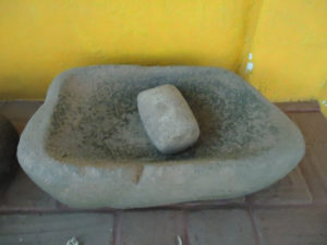 An antique stone metate and mano, used for grinding corn. © Alvin Starkman, 2011